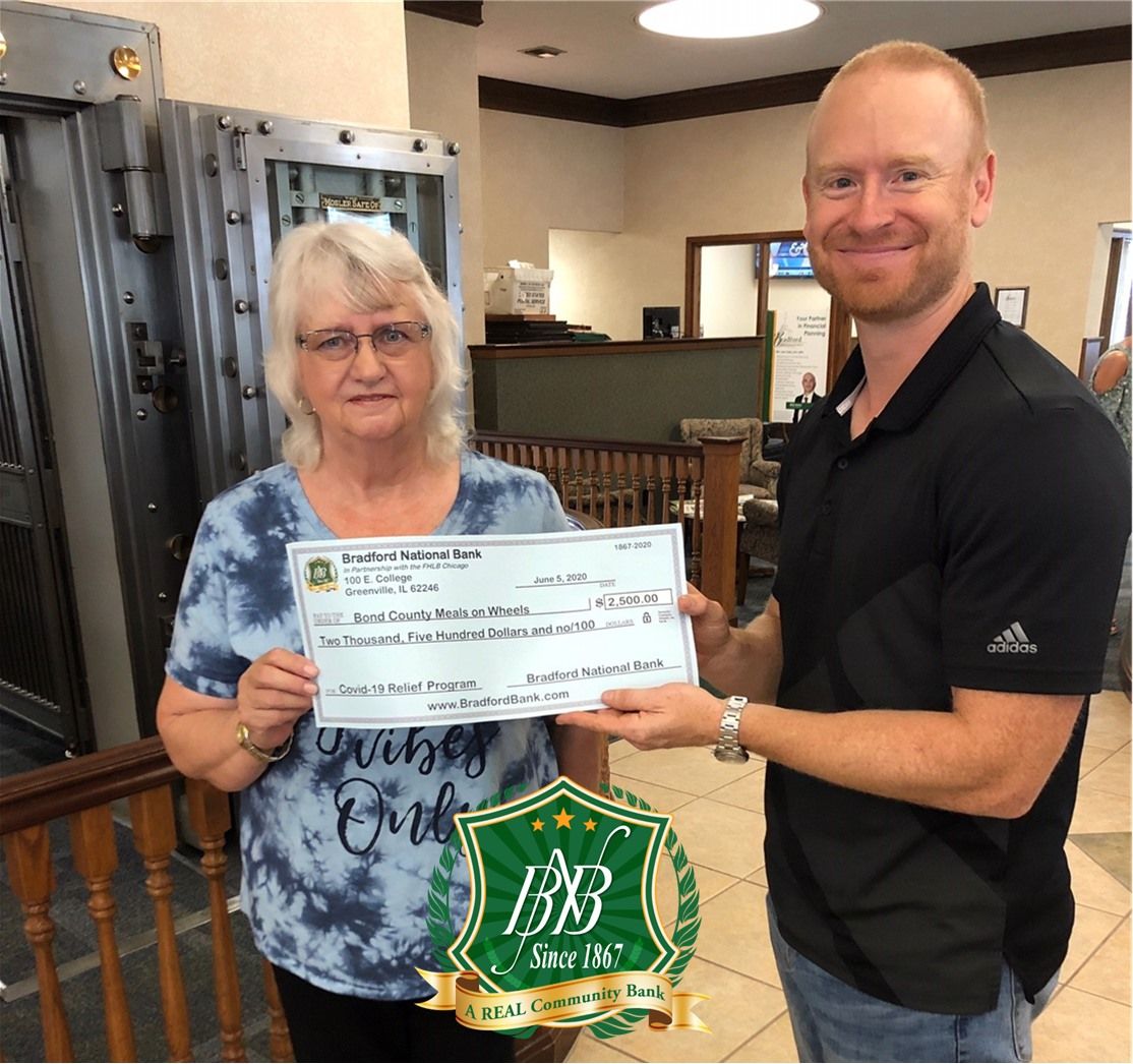 Meals on Wheels coordinator Darleen Jones was presented the contribution by Bradford National Bank Vice President Jace Keaster.